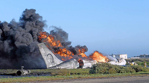 Patriot Environmental Services response team prepares to assist with the cleanup after an airplane burns after crashing