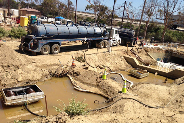 A Patriot Environmental Services team removes contaminated waste before a construction project can begin