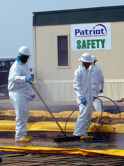 The importance of safety is reinforced by this safety banner prominently posted on a Patriot Environmental Services job site