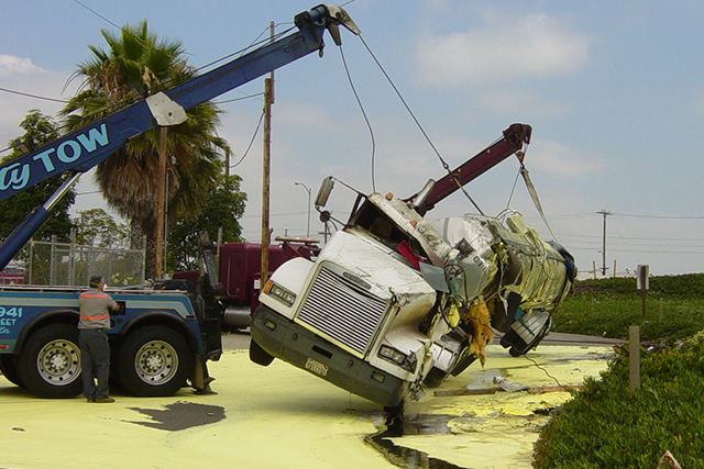 Patriot Environmental Services technicians hydro blast equipment in a utility to clean it before it is put back online