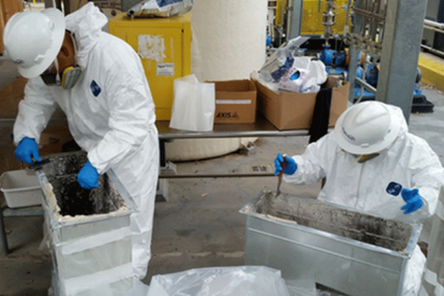 Patriot Environmental Services waste technicians prepare hazardous waste for shipping