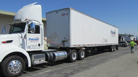 A Patriot Environmental Services 53-foot van trailer and tractor, permitted to transport non-hazardous and hazardous waste